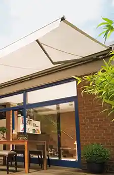 Side view of extended Topas folding arm awning