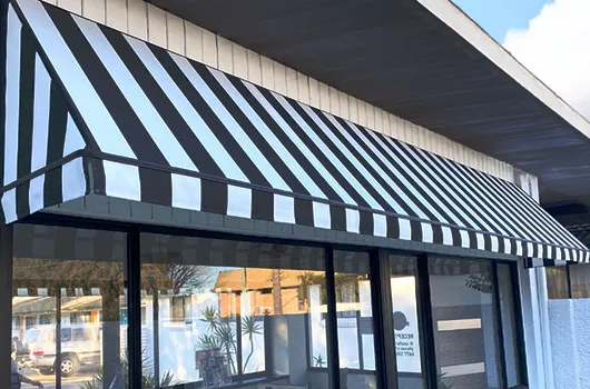 Shopfront with French canopy awning by Aurora Designs