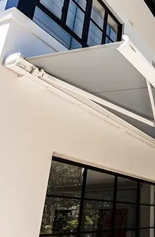 Front view of extended Opal folding awning