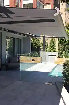 Side view of Opal folding arm awning outdoors