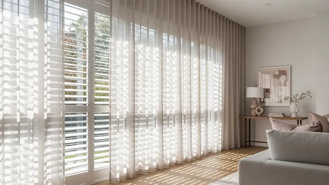 Shutters layered with sheer curtains Canberra | Aurora Window Furnishings