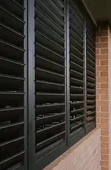 Outdoor living area with motorised shutters installed