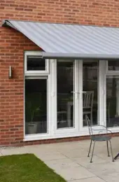 Outdoor space shaded by Cassita folding arm awning – Aurora Designs
