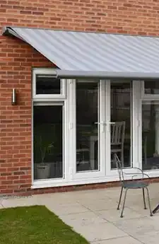 Outdoor space shaded by Cassita folding arm awning – Aurora Designs